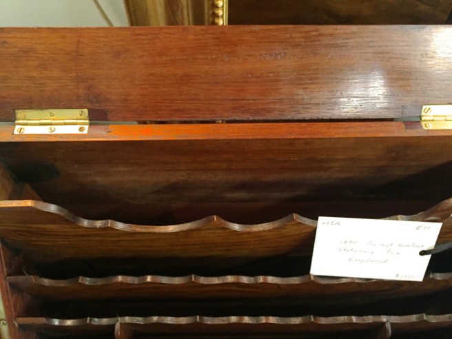 The calendar lifts out revealing more storage.