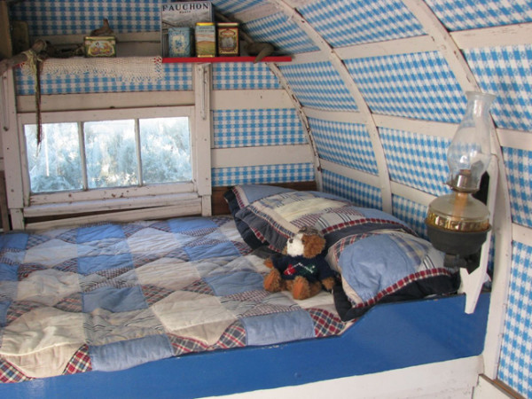 A double bed, cooking area, and a place to relax out of the weather. The essentials are covered.